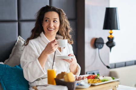 Breakfast in bed, cozy hotel room. conceptの写真素材