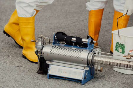 Coronavirus Quarantine. Disinfection and decontamination on a public place and factory as a prevention against Coronavirus disease 2019, COVID-19. State of emergency over pandemia with coronavirus.の写真素材