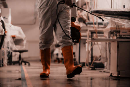 Coronavirus Quarantine. Disinfection and decontamination on a public place and factory as a prevention against Coronavirus disease 2019, COVID-19. State of emergency over pandemia with coronavirus.の写真素材