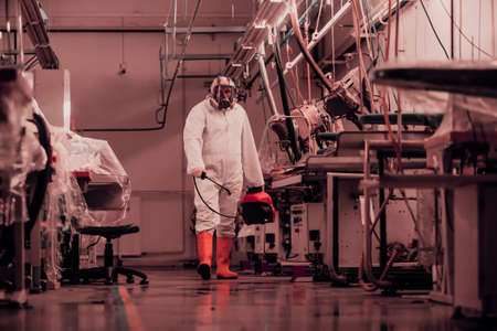 Coronavirus Quarantine. Disinfection and decontamination on a public place and factory as a prevention against Coronavirus disease 2019, COVID-19. State of emergency over pandemia with coronavirus.の写真素材