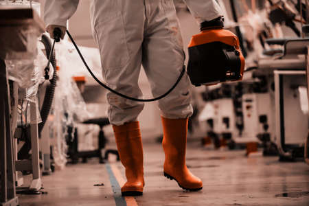Coronavirus Quarantine. Disinfection and decontamination on a public place and factory as a...