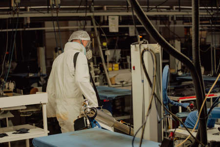 Coronavirus Quarantine. Disinfection and decontamination on a public place and factory as a prevention against Coronavirus disease 2019, COVID-19. State of emergency over pandemia with coronavirus.の写真素材