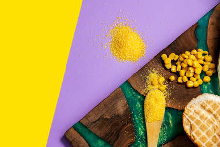 Polenta or cornmeal on luxury nut tree epoxy plank with  green resin
