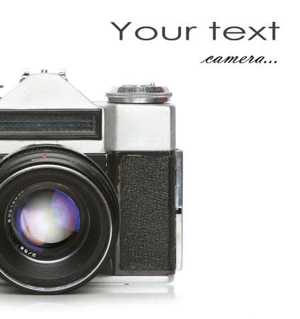 Old film camera with scratches and dust, on white background