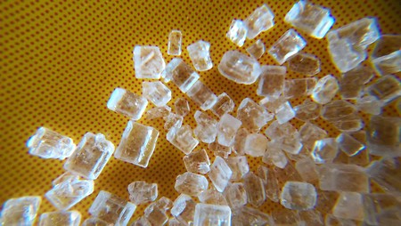 Sugar crystals on yellow background