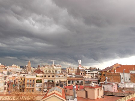 Stormy clouds over the cityの写真素材