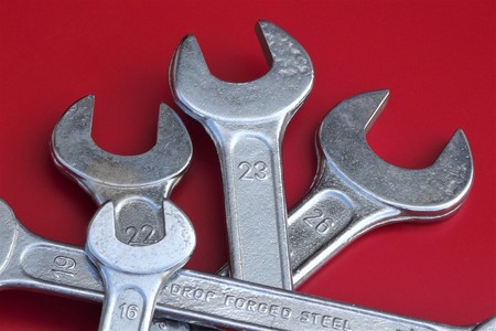 Set of spanners of different sizes on red background