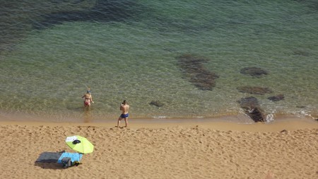 Top view of a beach with a couple of bathersの写真素材