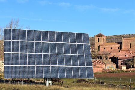 Solar energy panels installed to produce electricity in a traditional village. Soria Spain