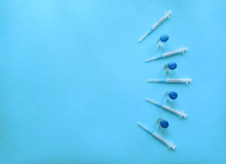 Vaccination of the epidemic . Syringes and injections on a blue backgroundの写真素材