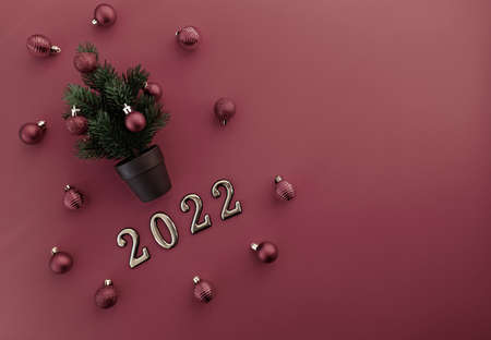 A greeting card. A small Christmas tree in a pot decorated with red shiny balls on a cherry...