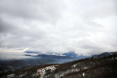 Low gliding clouds above peaks of the Balkans, cloudy day high in the mountains, Macedonia.の写真素材
