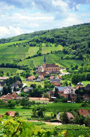 Route des vines in Alsace - France, village in Vosges Mountains. Vineyard. French country. Route des vines in Alsace - France, village in Vosges Mountains. Vineyard. French country.