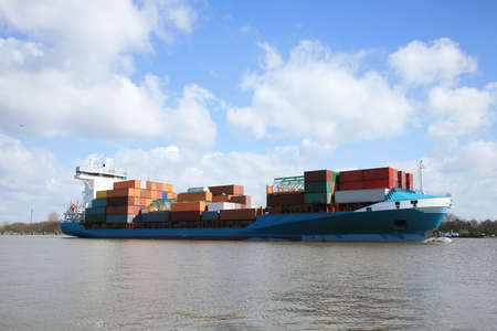 Container ship with cargo on the Kiel Canal, Germany. の写真素材