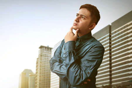 Young man thinkingの写真素材