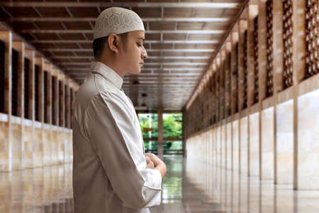 Muslim man praying in mosqueの写真素材