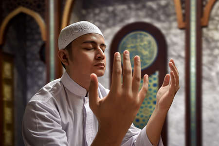 Muslim man praying in mosqueの写真素材