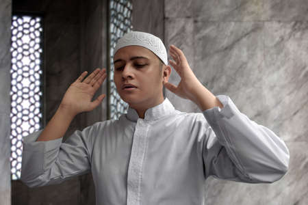 Muslim man praying in mosqueの写真素材