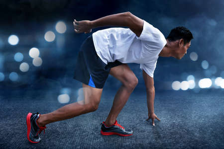 Asian man ready to runの写真素材