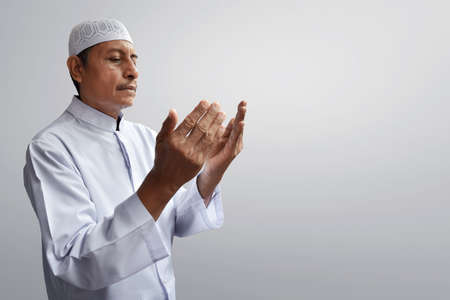 Old muslim man praying
