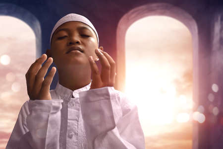 Asian muslim kid praying in mosqueの写真素材