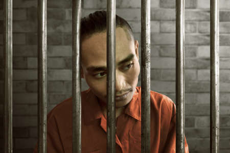 Asian man in prisonの写真素材