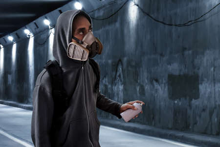 Graffiti artist wearing respirator maskの写真素材
