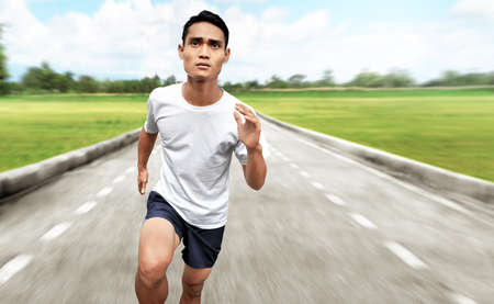 Asian man runningの写真素材