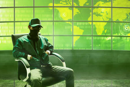 Hacker sitting on the chairの写真素材