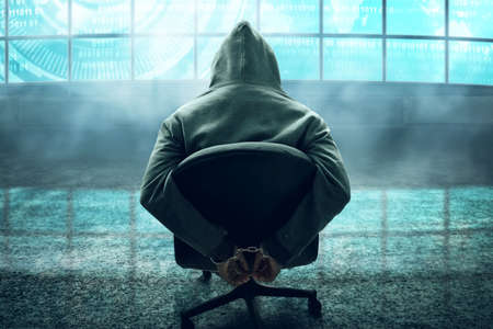 Hacker in handcuffsの写真素材
