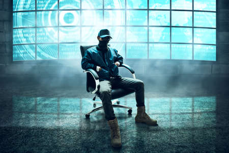 Hacker sitting on the chairの写真素材