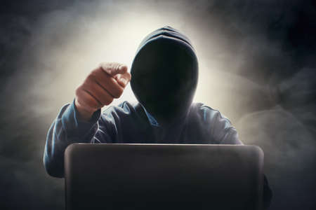 Hacker using laptop
