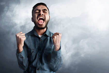 Asian man celebratingの写真素材