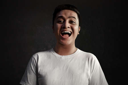 Asian man laughingの写真素材