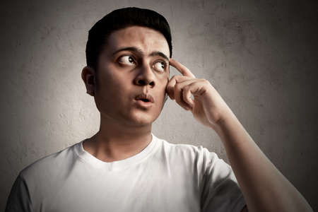 Asian man thinkingの写真素材