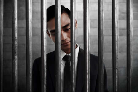 Businessman in prisonの写真素材