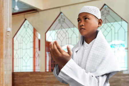 Asian muslim kid praying