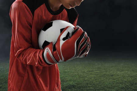 Soccer goalkeeper catches the ballの写真素材