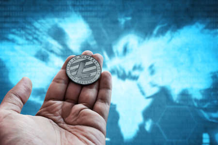 Hand holding litecoin