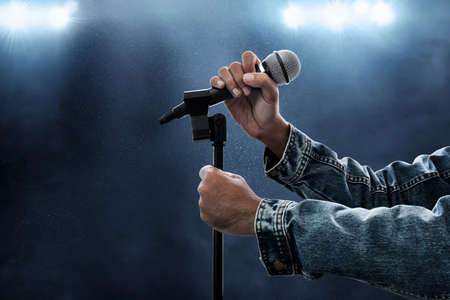 Hands holding microphone