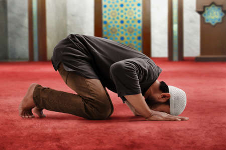 Religious muslim man praying in mosqueの写真素材
