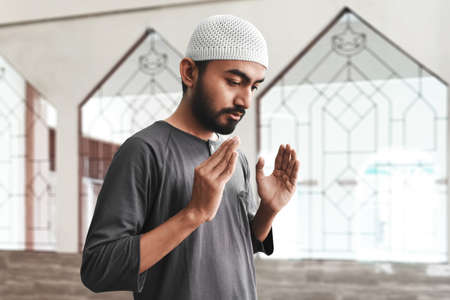 Religious asian muslim man prayingの写真素材