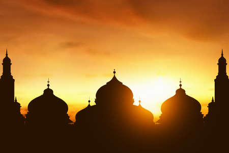 Silhouette of mosque at sunsetの写真素材