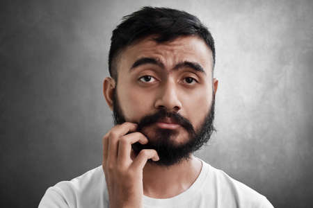 Portrait of sleepy bearded man