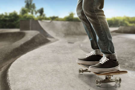 Skateboarder skateboarding at skate parkの写真素材