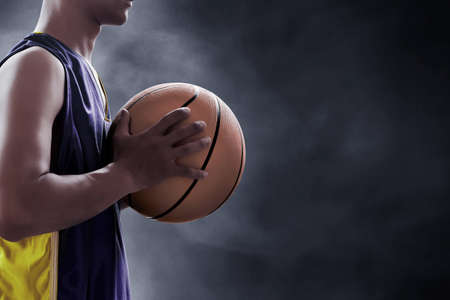 Basketball player holding a ball