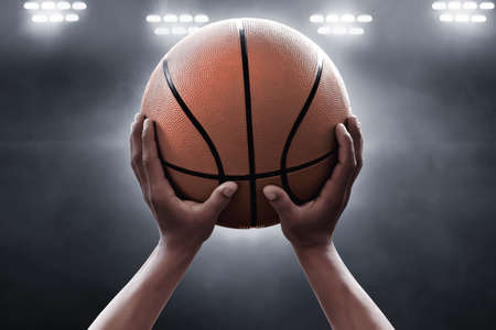 Basketball player throwing a ballの写真素材