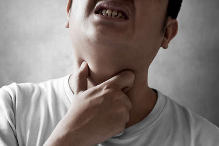 Young man with sore throat