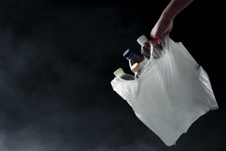 Plastic bottle in garbage bag