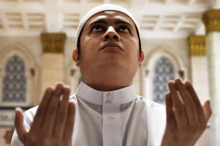 Religious asian muslim man praying